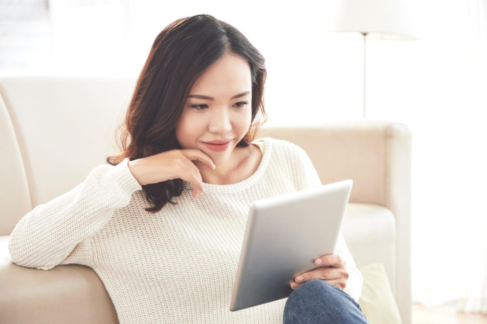 IT professional analyzing system performance metrics on multiple monitors